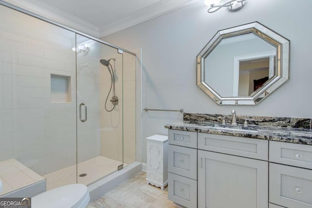 full bathroom featuring vanity, ornamental molding, a shower stall, toilet, and marble finish floor