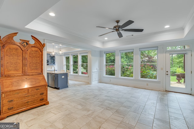 3845 Starboard Pt, Gainesville, GA 30506 - unfurnished living room featuring a tray ceiling, a ceiling fan, a sink, and ornamental molding