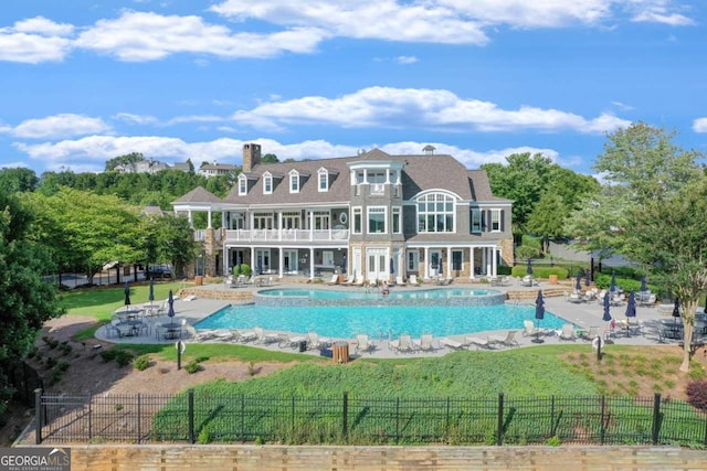 view of pool featuring a fenced in pool, a yard, a patio area, and fence