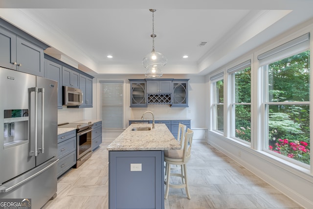 3845 Starboard Pt, Gainesville, GA 30506 - kitchen with stainless steel appliances, a sink, ornamental molding, a kitchen breakfast bar, and a center island with sink