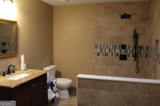 3801 Gold Leaf Ct, Stockbridge, GA 30281 - bathroom featuring a tile shower, vanity, and tile patterned floors
