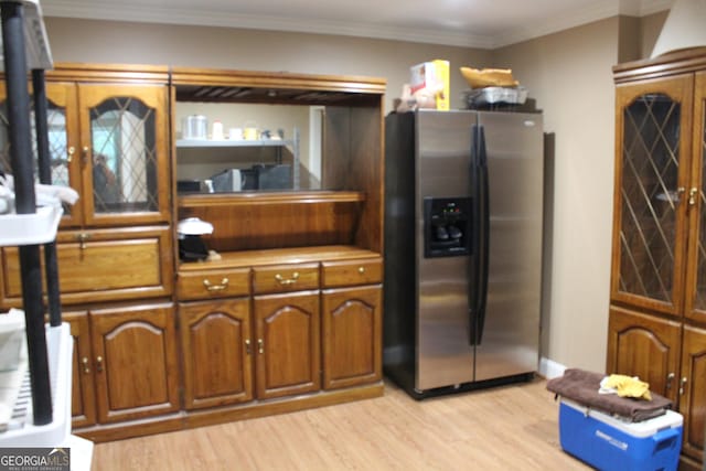 3801 Gold Leaf Ct, Stockbridge, GA 30281 - kitchen featuring stainless steel refrigerator with ice dispenser, light wood finished floors, brown cabinets, crown molding, and light countertops