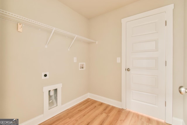 laundry area with electric dryer hookup, light wood finished floors, baseboards, hookup for a washing machine, and laundry area