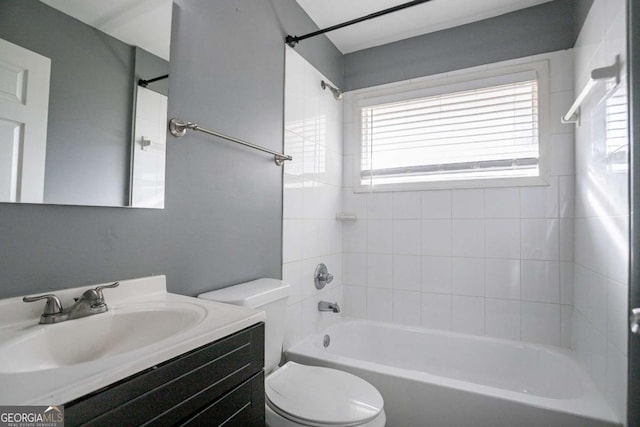 full bath featuring vanity, toilet, and shower / washtub combination