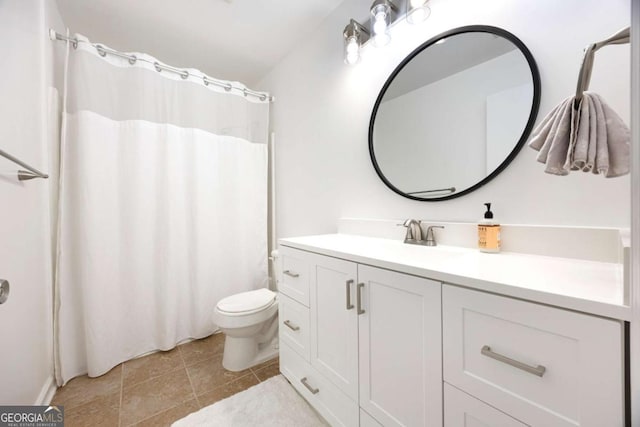 bathroom with vanity, a shower with shower curtain, toilet, and tile patterned flooring