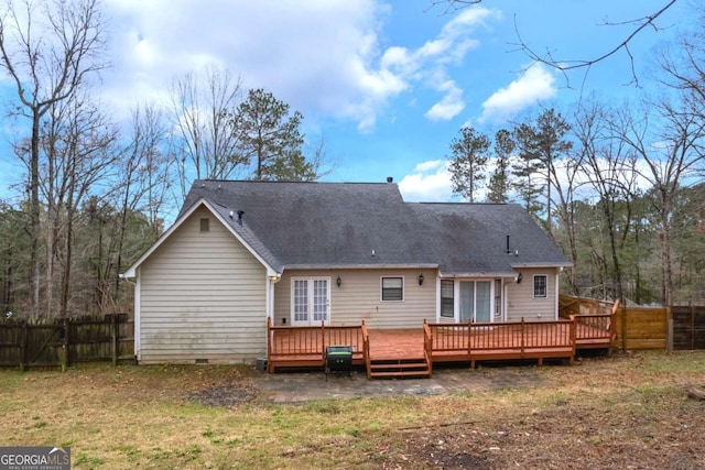 back of house featuring a deck, a gate, fence, roof with shingles, and crawl space