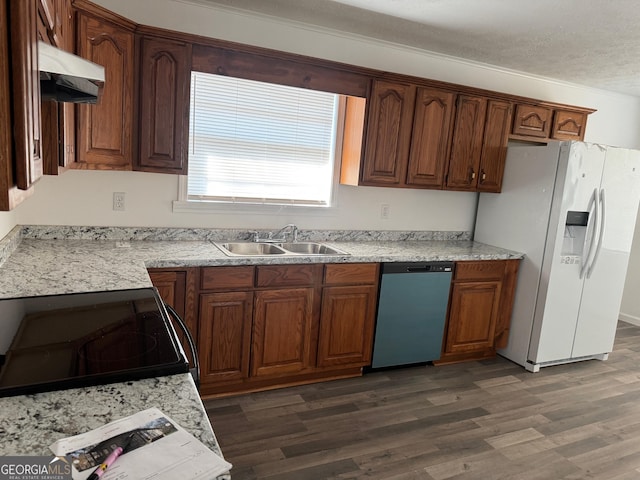 kitchen featuring dishwashing machine, electric range, a sink, white refrigerator with ice dispenser, and under cabinet range hood