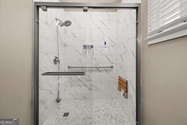 bathroom with a shower stall