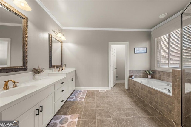 full bath featuring a sink, crown molding, double vanity, baseboards, and a bath