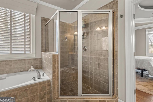 full bath with a garden tub, a stall shower, ensuite bathroom, wood finished floors, and crown molding