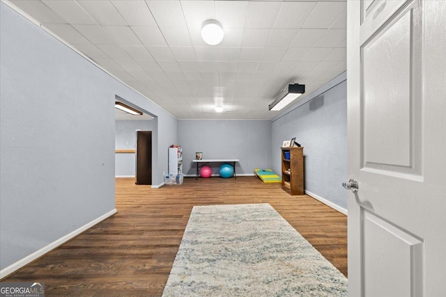 interior space featuring dark wood-style floors and baseboards