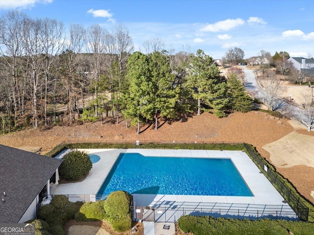 view of swimming pool with a patio, fence, and a fenced in pool