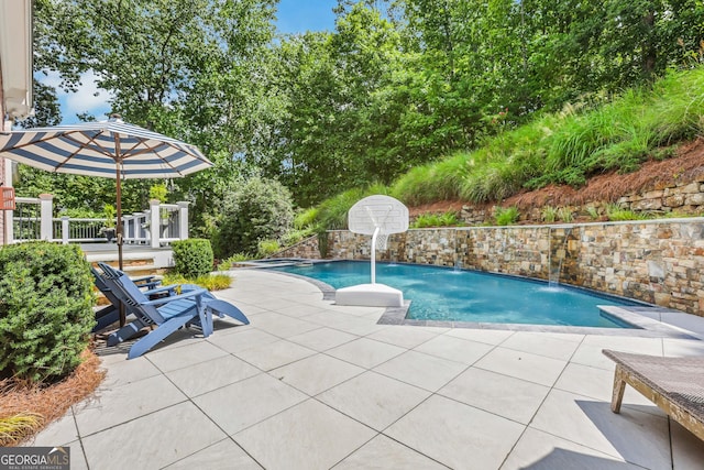 pool with a patio area