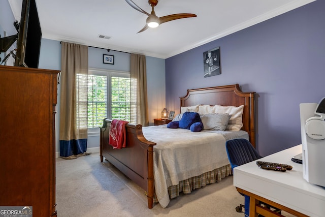 carpeted bedroom with ceiling fan, visible vents, and ornamental molding