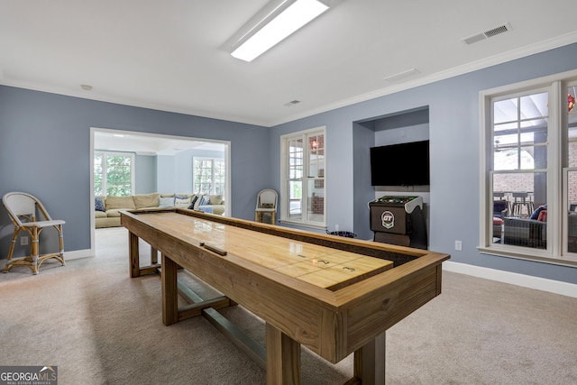 recreation room featuring carpet, visible vents, and ornamental molding