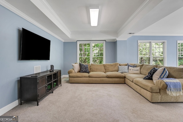 living room featuring visible vents, baseboards, light colored carpet, a tray ceiling, and ornamental molding