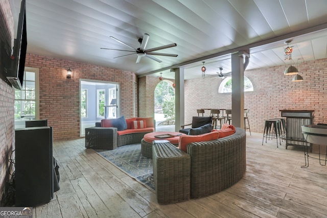 deck featuring an outdoor living space and a ceiling fan