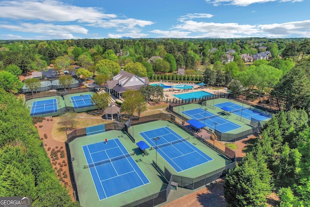 drone / aerial view with a view of trees