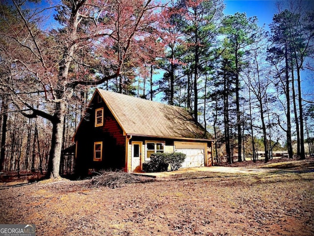 garage featuring driveway