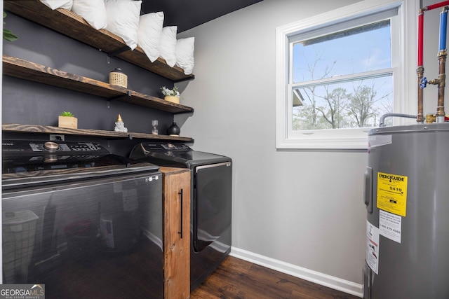 laundry room with laundry area, electric water heater, independent washer and dryer, baseboards, and dark wood-type flooring