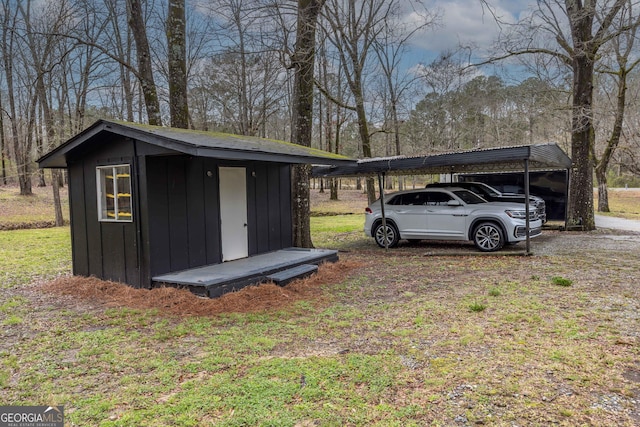 view of shed featuring a detached carport and driveway