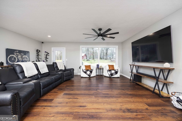 living area featuring baseboards, recessed lighting, wood finished floors, and a ceiling fan