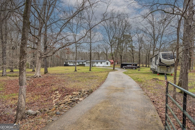 view of street with concrete driveway