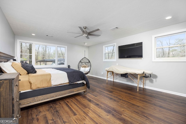 bedroom featuring baseboards, visible vents, wood finished floors, and recessed lighting