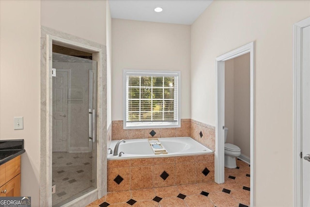 full bathroom featuring toilet, a garden tub, a stall shower, tile patterned floors, and vanity