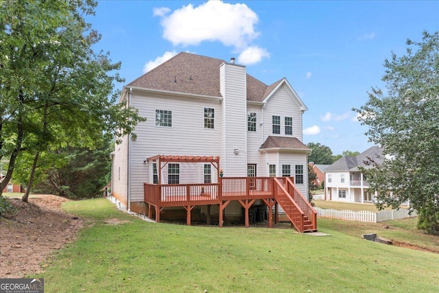 back of property with fence, stairway, a wooden deck, a chimney, and a yard