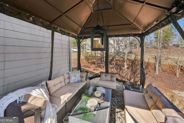 view of patio featuring a gazebo and outdoor lounge area