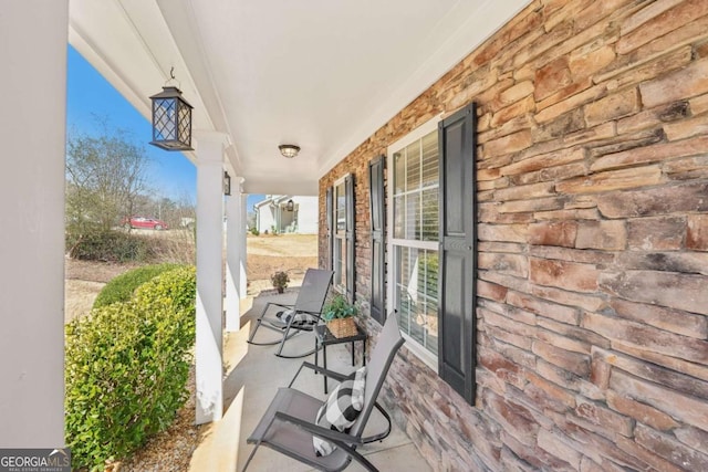 view of patio featuring a porch