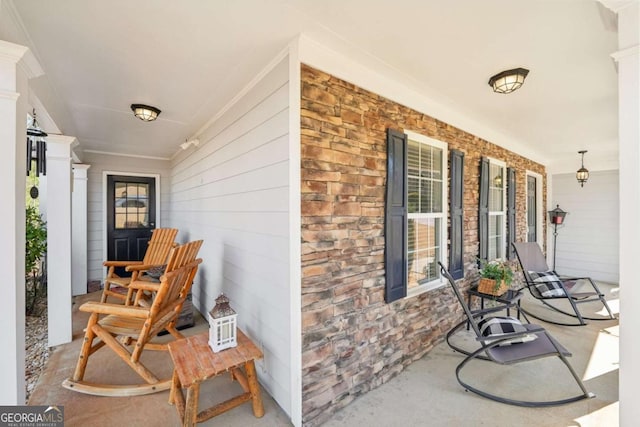 view of patio featuring a porch