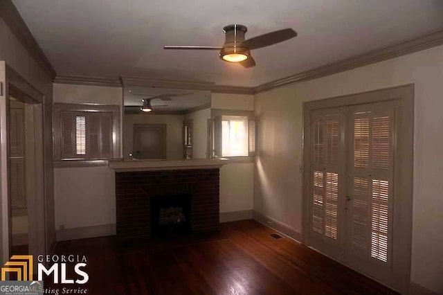 unfurnished living room with wood finished floors, a fireplace, and ornamental molding