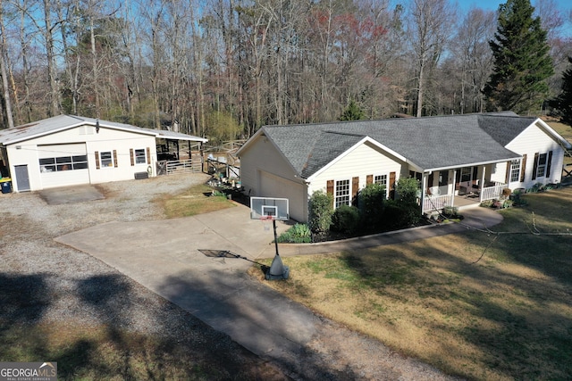 single story home with a porch, a front lawn, and roof with shingles