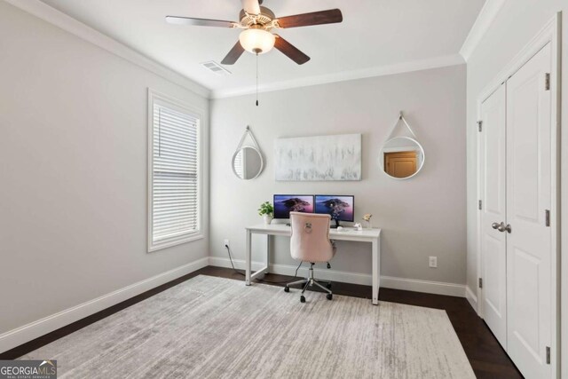 office area with visible vents, baseboards, wood finished floors, and crown molding