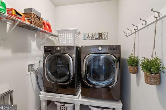 laundry room with washing machine and dryer and laundry area