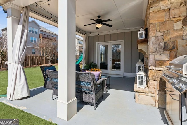 view of patio / terrace featuring grilling area, ceiling fan, fence, french doors, and an outdoor hangout area