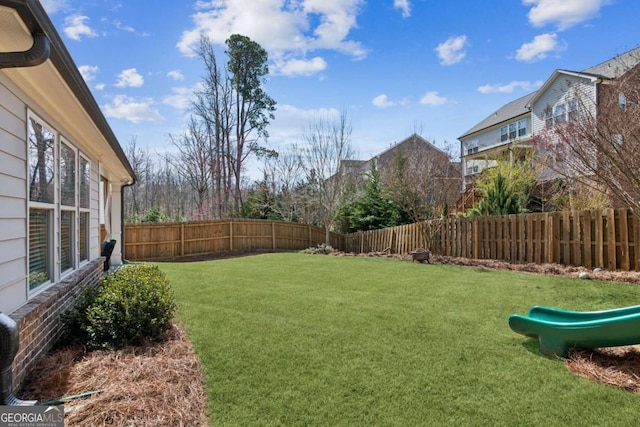 view of yard with a fenced backyard