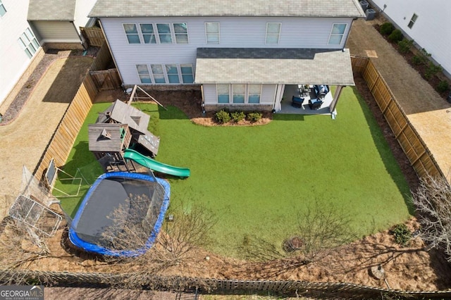 exterior space featuring a yard, a fenced backyard, and a patio area