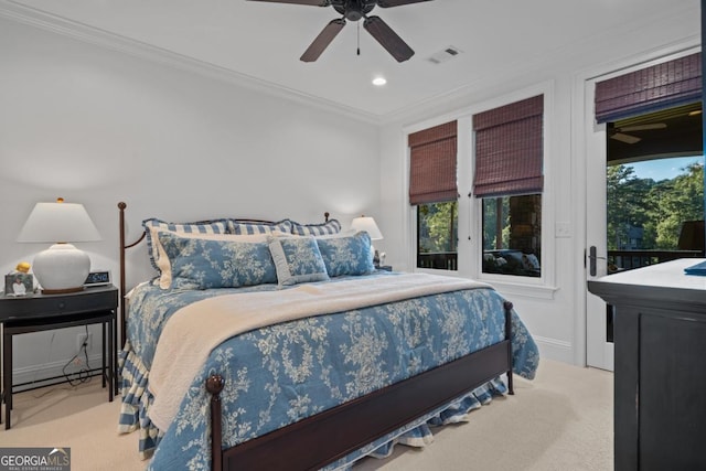 carpeted bedroom with visible vents, multiple windows, crown molding, and access to outside