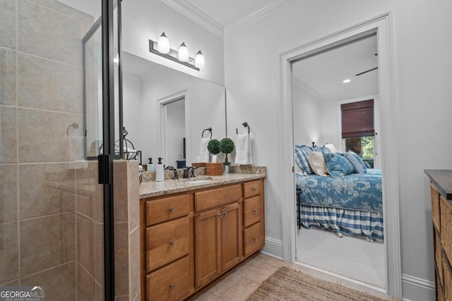 full bath with a shower stall, crown molding, ensuite bathroom, tile patterned floors, and vanity