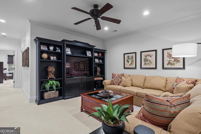 living area featuring baseboards, ornamental molding, light carpet, recessed lighting, and a ceiling fan