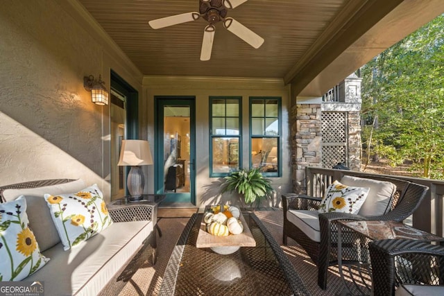 exterior space featuring outdoor lounge area and a ceiling fan