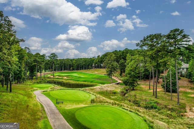 surrounding community featuring view of golf course