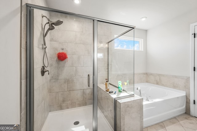 bathroom with a bath, tile patterned floors, recessed lighting, and a shower stall