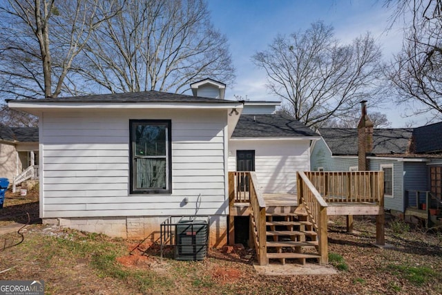 rear view of house featuring a deck