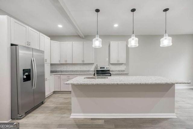 kitchen with decorative backsplash, a center island with sink, stainless steel appliances, and a sink