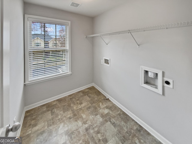 laundry area featuring laundry area, hookup for a washing machine, baseboards, and visible vents