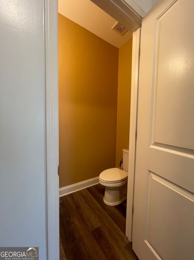 5928 Cobblestone Creek Cir, Mableton, GA 30126 - bathroom featuring toilet, wood finished floors, baseboards, and visible vents